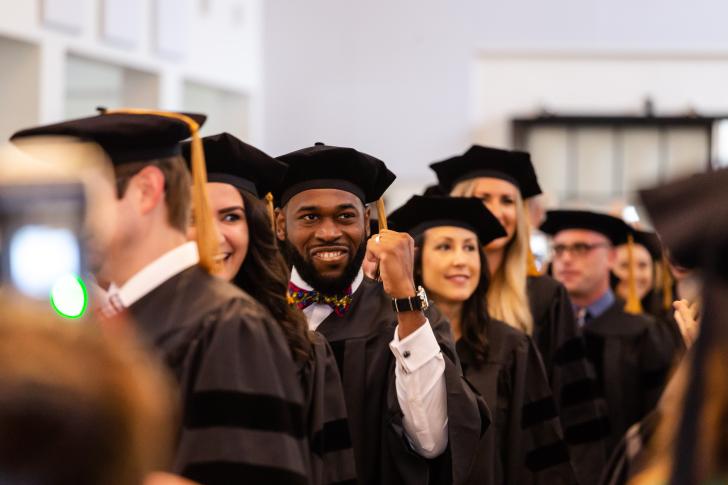 Bastyr alum excited and clenching fist in success